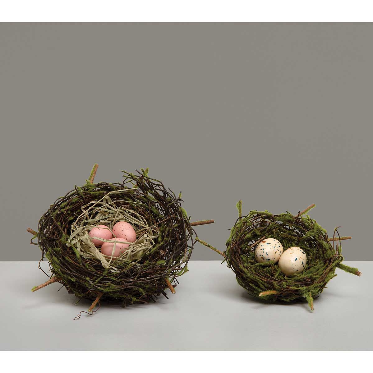 TWIG NEST WITH RAFFIA, MOSS AND PINK EGGS 6"X2.5"